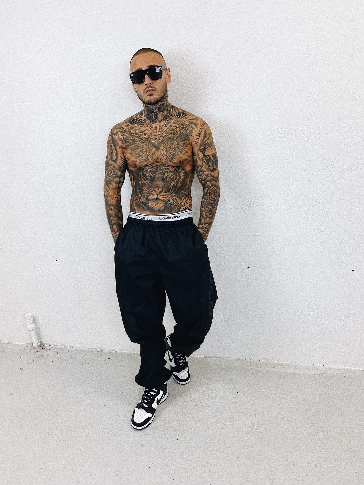 Nike embroidered track pants (L)